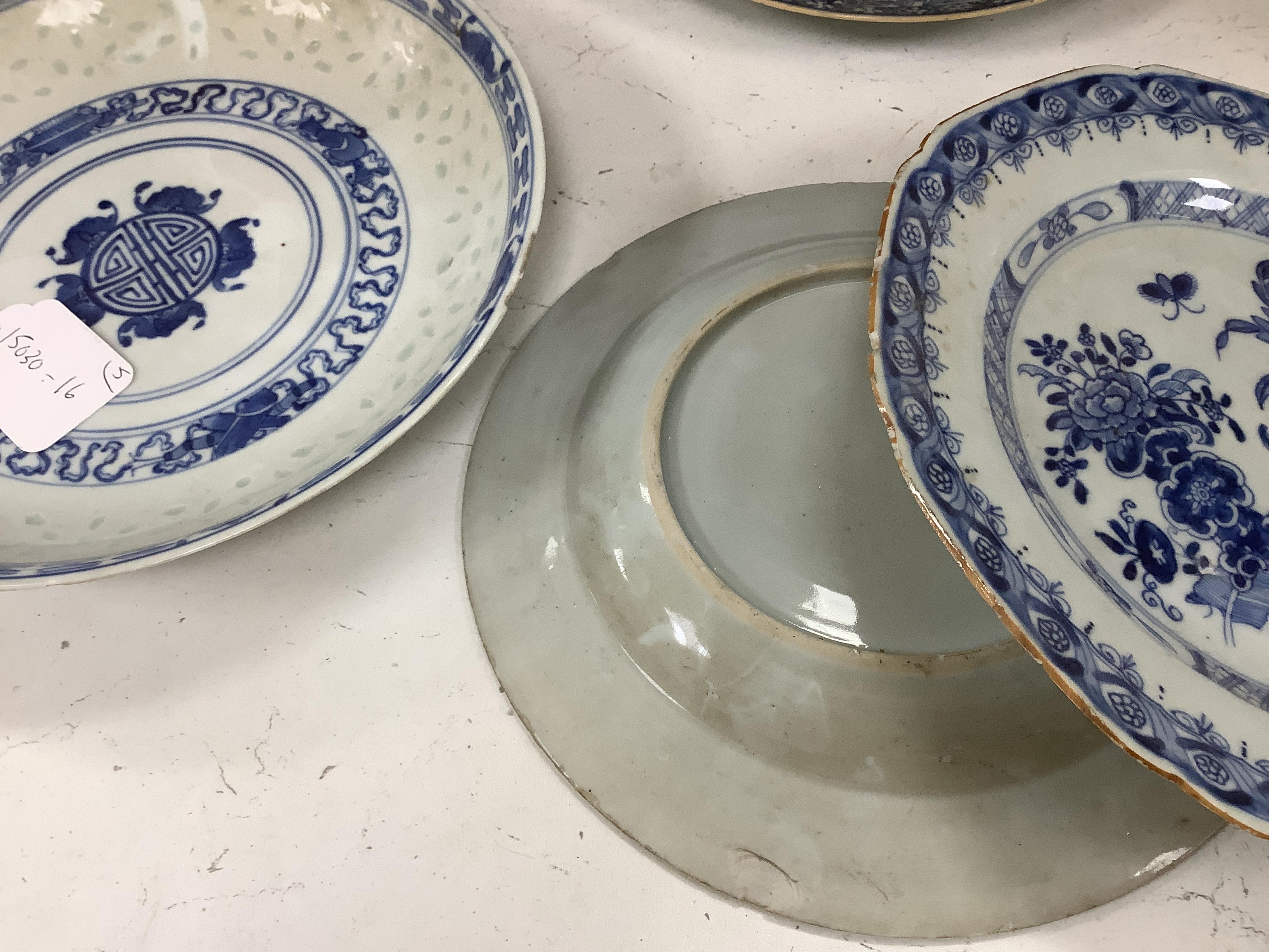 Four Chinese blue and white export plates and a rice bowl, bowl 24.5cm diameter. Condition - poor to fair, some damage to the edges